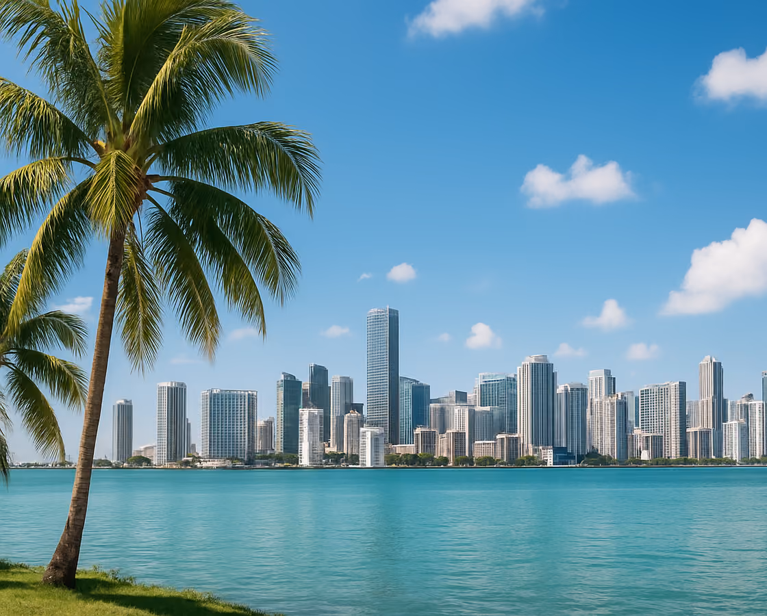 Miami, Florida skyline over Biscayne Bay with palm trees in the foreground
