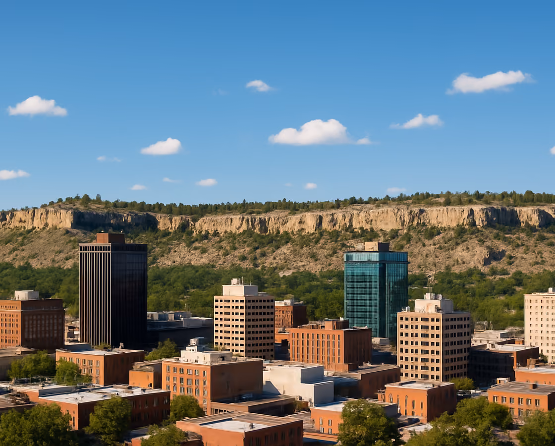 Downtown Billings, Montana skyline beneath the Rimrocks sandstone cliffs